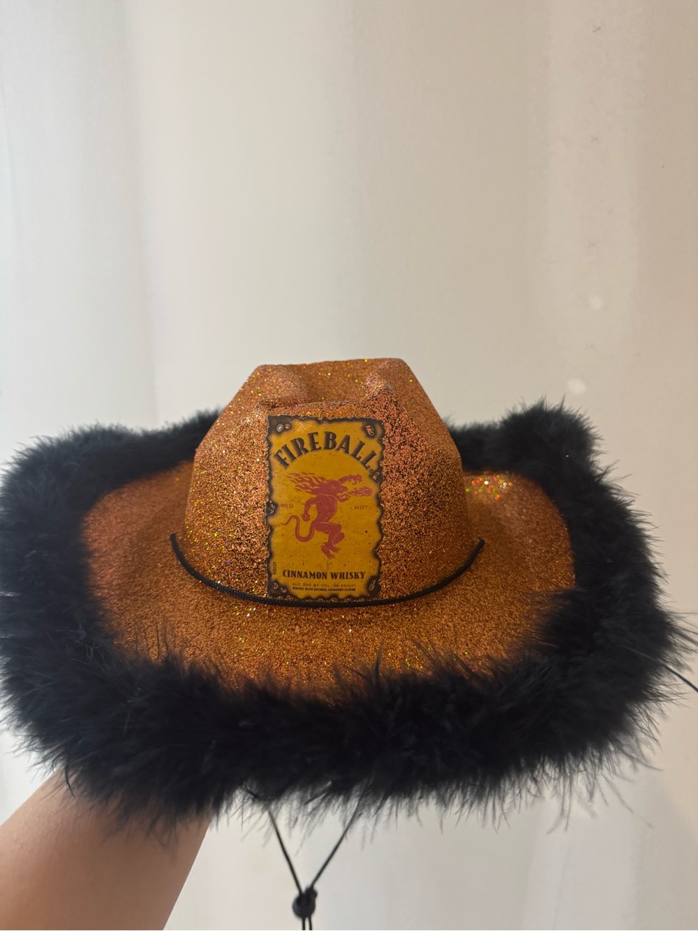 Glitter Orange Cowboy Hat with Black Feather Trim